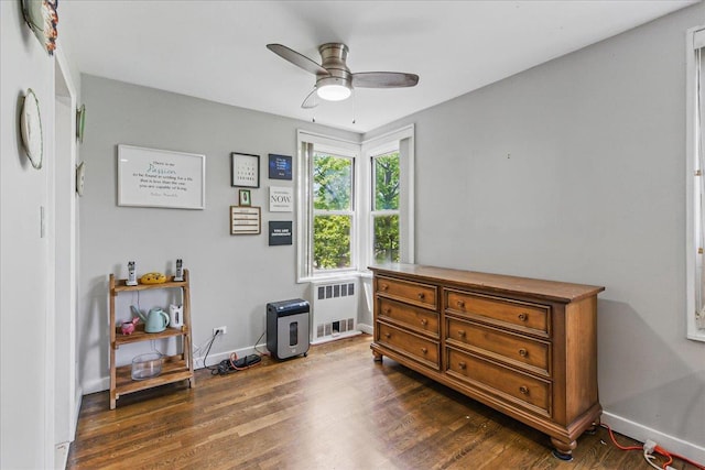 209-80 18th Ave Unit 4D, Bayside, NY 11360 - bedroom with radiator heating unit, dark wood-style flooring, and a ceiling fan