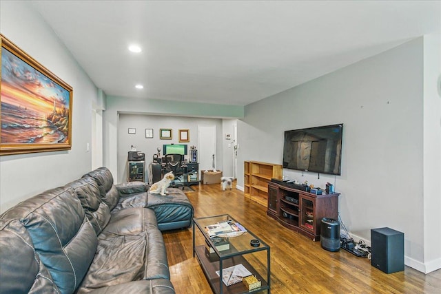 209-80 18th Ave Unit 4D, Bayside, NY 11360 - living area featuring wood finished floors, recessed lighting, and a desk