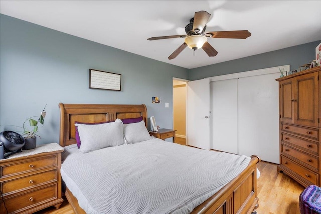 209-80 18th Ave Unit 4D, Bayside, NY 11360 - bedroom with a closet, light wood-style flooring, and a ceiling fan