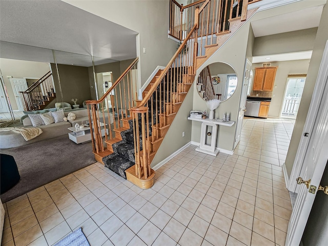2717 Colonial Dr, New Windsor, NY 12553 - stairway with tile patterned flooring and baseboards