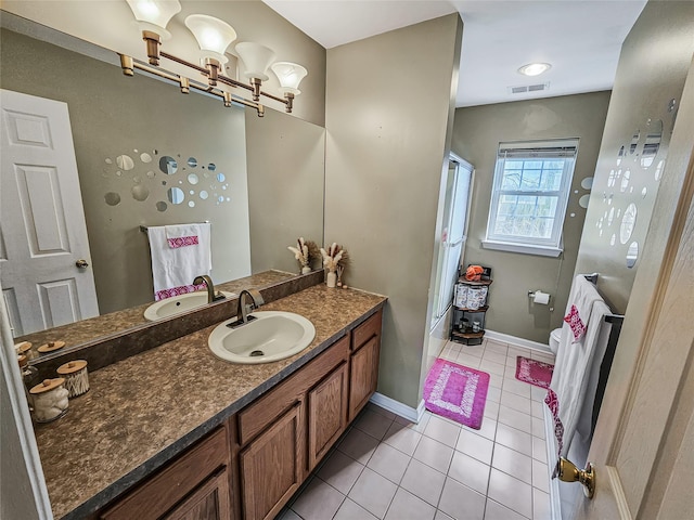 2717 Colonial Dr, New Windsor, NY 12553 - bathroom featuring tile patterned floors, vanity, toilet, a chandelier, and baseboards