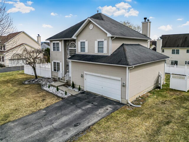 2717 Colonial Dr, New Windsor, NY 12553 - view of front of property featuring roof with shingles, driveway, an attached garage, and a chimney