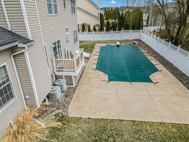 2717 Colonial Dr, New Windsor, NY 12553 - view of pool featuring a fenced backyard, a patio, and central AC unit