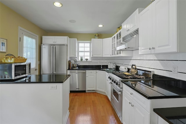 17 Deer Tree Ln, Briarcliff Manor, NY 10510 - kitchen featuring high quality appliances, dark countertops, decorative backsplash, white cabinets, and recessed lighting