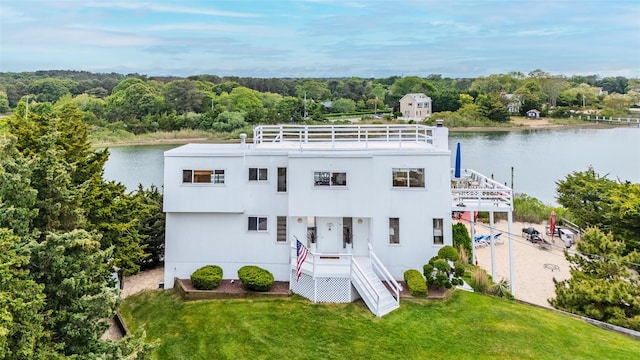 19 Cold Spring Ct, Southampton, NY 11968 - view of front of home with a water view and a front yard