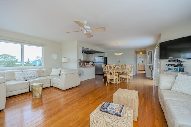 19 Cold Spring Ct, Southampton, NY 11968 - living area with a ceiling fan and light wood-style floors