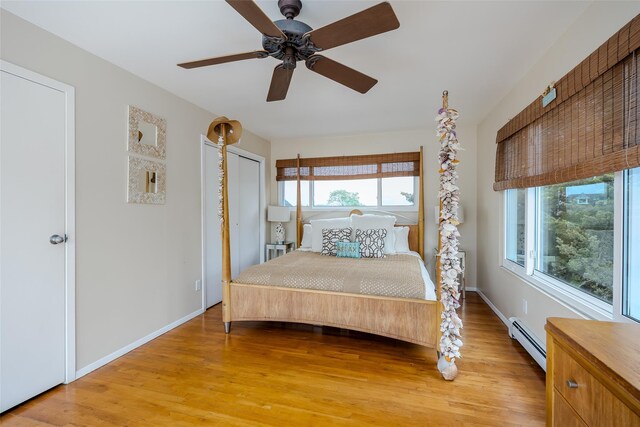 19 Cold Spring Ct, Southampton, NY 11968 - bedroom with baseboard heating, light wood-style flooring, and ceiling fan