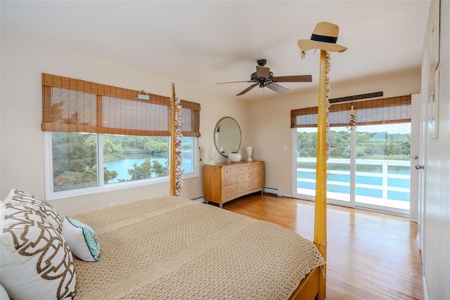 19 Cold Spring Ct, Southampton, NY 11968 - bedroom featuring access to exterior, a baseboard radiator, and wood finished floors