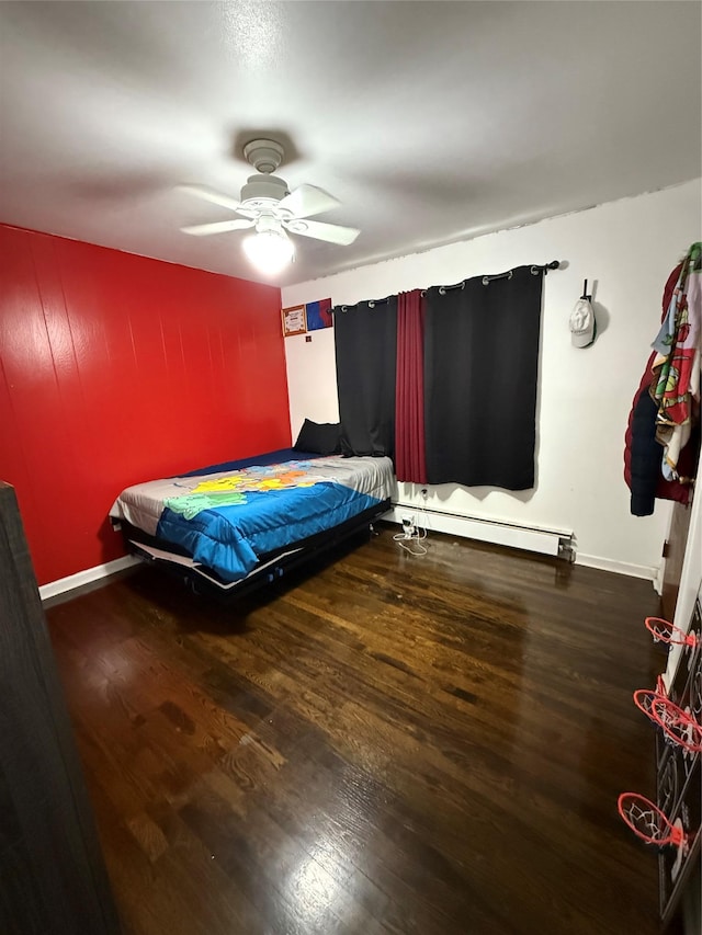 77 Upper Rd, Bloomingburg, NY 10940 - bedroom with wood finished floors, a baseboard radiator, baseboards, and a ceiling fan