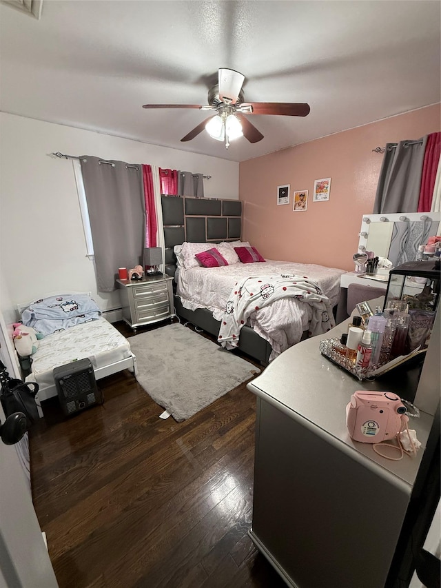 77 Upper Rd, Bloomingburg, NY 10940 - bedroom featuring wood finished floors, ceiling fan, and baseboard heating