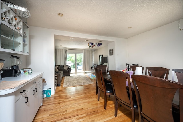 929 Fox Meadow Rd, Yorktown Heights, NY 10598 - dining space featuring light wood-type flooring, a textured ceiling, and recessed lighting