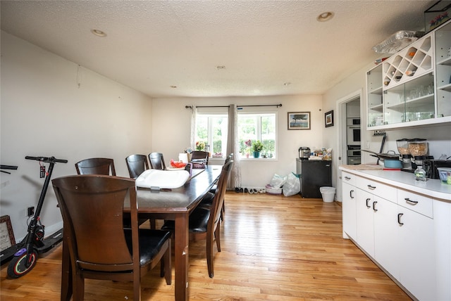 929 Fox Meadow Rd, Yorktown Heights, NY 10598 - dining room with light wood finished floors and a textured ceiling