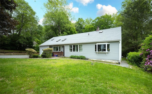 929 Fox Meadow Rd, Yorktown Heights, NY 10598 - view of front of home featuring a front yard, a chimney, and a shingled roof