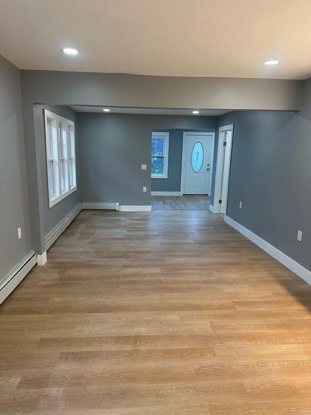 123 Mitchell St, North Bellmore, NY 11710 - spare room featuring baseboards, light wood finished floors, and recessed lighting