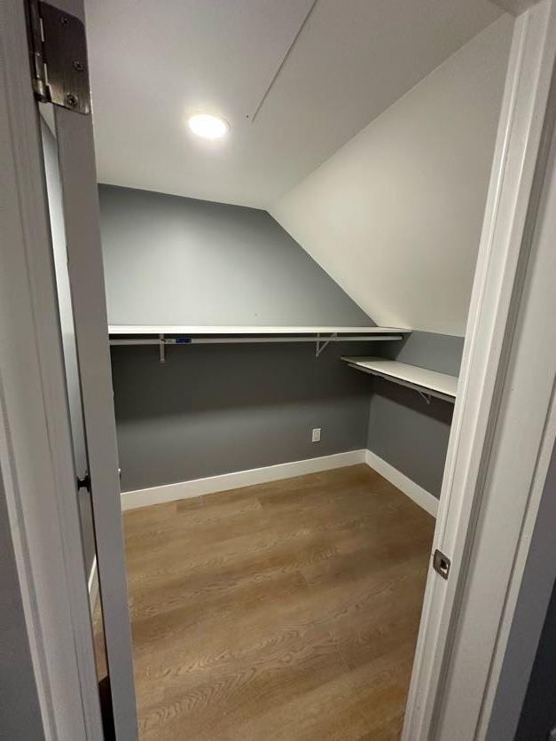 123 Mitchell St, North Bellmore, NY 11710 - spacious closet with wood finished floors and lofted ceiling