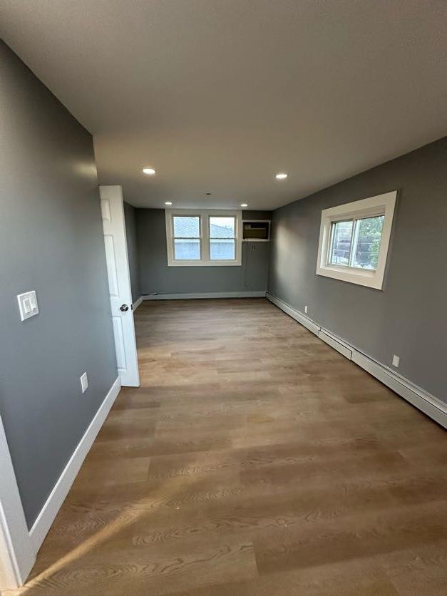 123 Mitchell St, North Bellmore, NY 11710 - unfurnished room featuring baseboards, wood finished floors, and recessed lighting
