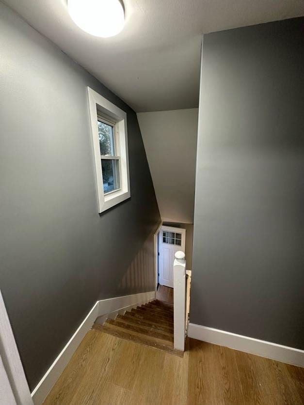 123 Mitchell St, North Bellmore, NY 11710 - staircase featuring baseboards and wood finished floors