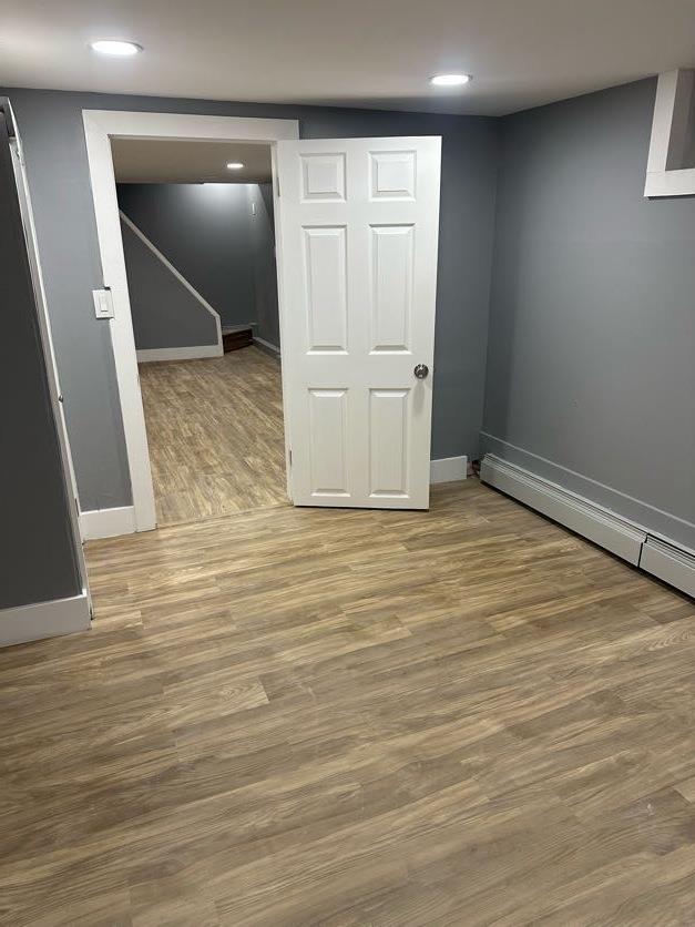 123 Mitchell St, North Bellmore, NY 11710 - finished below grade area with baseboards, wood finished floors, and recessed lighting