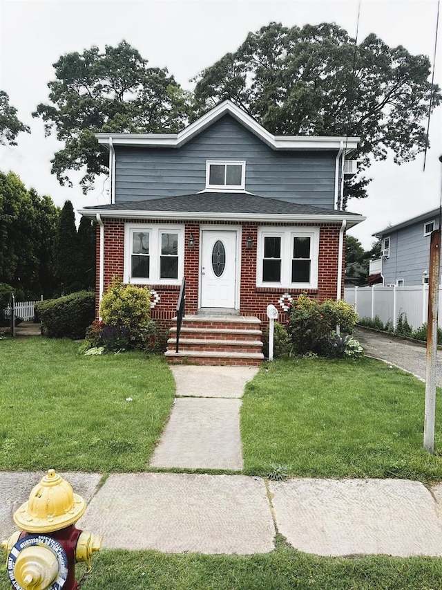 123 Mitchell St, North Bellmore, NY 11710 - view of front of property with brick siding, entry steps, and a shingled roof