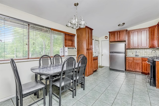 581 Union Rd, Spring Valley, NY 10977 - dining area with a chandelier and light tile patterned floors