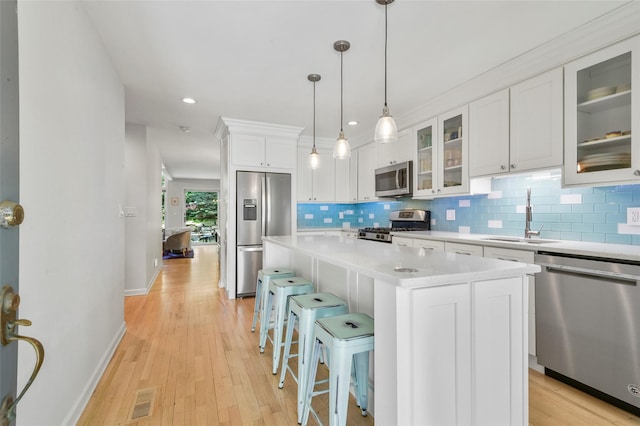 2032 Palmer Ave, Larchmont, NY 10538 - kitchen featuring appliances with stainless steel finishes, a sink, white cabinets, backsplash, and recessed lighting