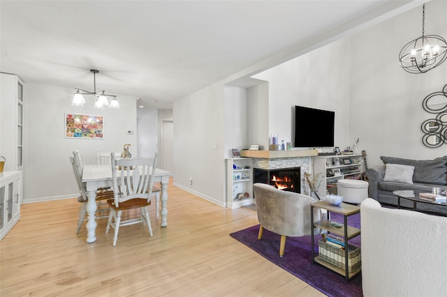 2032 Palmer Ave, Larchmont, NY 10538 - dining area featuring a chandelier, light wood-type flooring, and baseboards