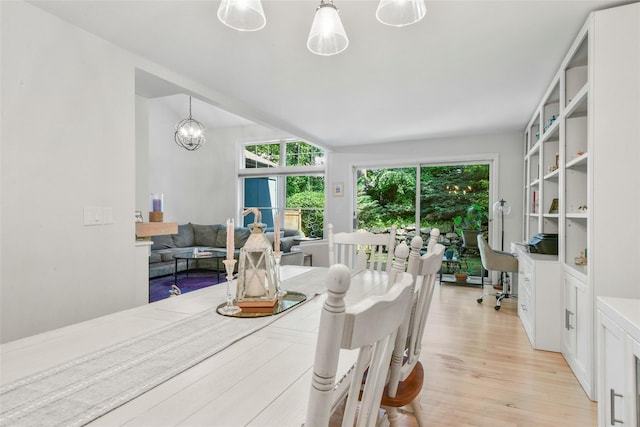 2032 Palmer Ave, Larchmont, NY 10538 - dining area with light wood-type flooring and a chandelier