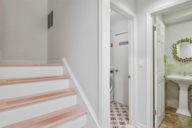 2032 Palmer Ave, Larchmont, NY 10538 - stairs featuring washer / dryer and tile patterned floors