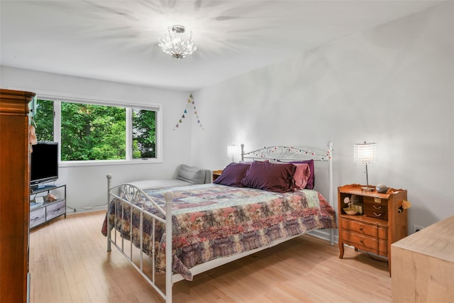 2032 Palmer Ave, Larchmont, NY 10538 - bedroom with light wood finished floors and a chandelier