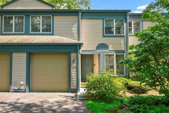 2032 Palmer Ave, Larchmont, NY 10538 - view of front facade with driveway and a garage