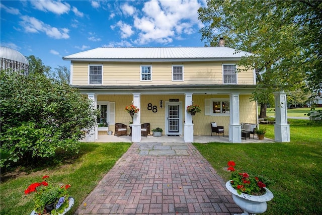 88 Prices Switch Rd, Warwick, NY 10990 - view of front facade with a chimney, a front yard, metal roof, and covered porch