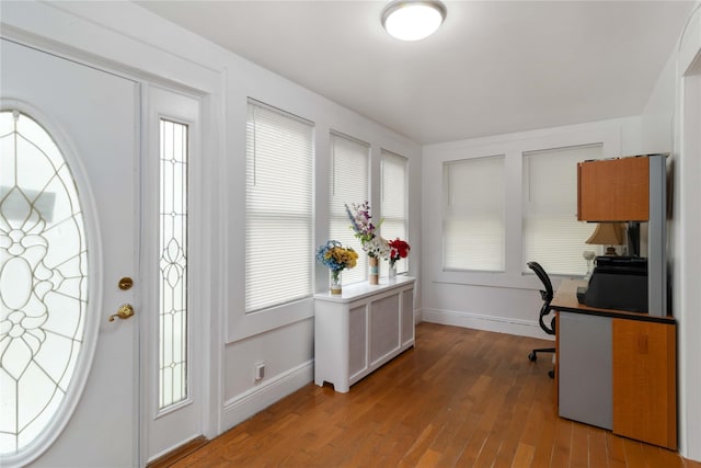 114-18 175th St, Addisleigh Park, NY 11434 - home office with wood-type flooring, baseboards, and healthy amount of natural light