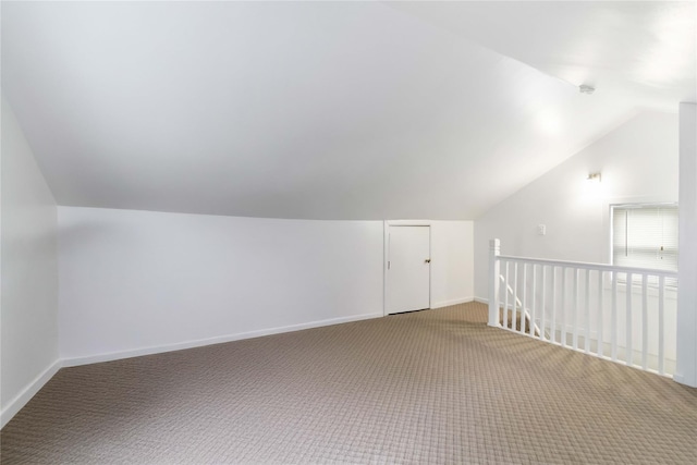 114-18 175th St, Addisleigh Park, NY 11434 - additional living space with lofted ceiling, light carpet, and baseboards