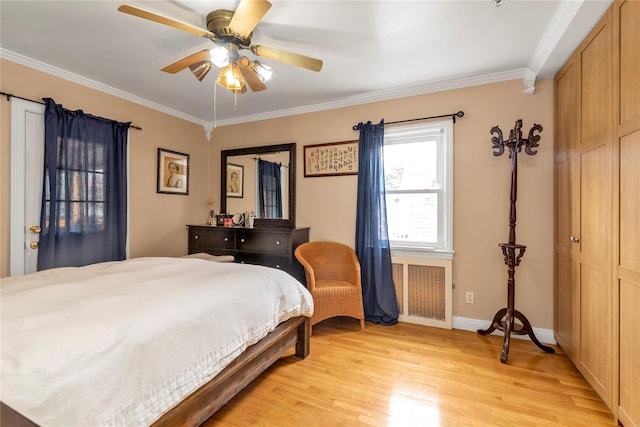 590 Langley Ave, West Hempstead, NY 11552 - bedroom featuring light wood finished floors, crown molding, ceiling fan, and baseboards