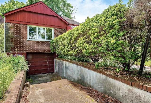 85-82 66th Rd, Rego Park, NY 11374 - view of side of property featuring brick siding and an attached garage