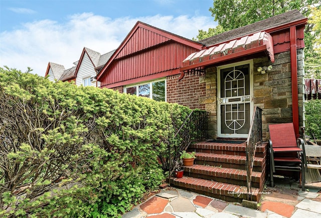 85-82 66th Rd, Rego Park, NY 11374 - property entrance with board and batten siding and stone siding