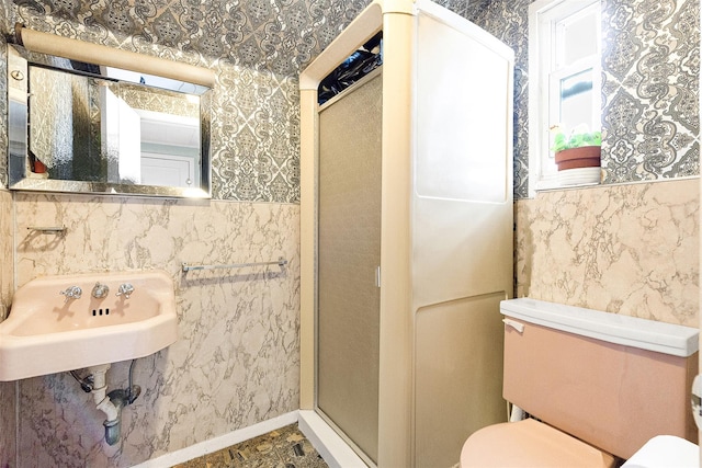 85-82 66th Rd, Rego Park, NY 11374 - bathroom featuring toilet, a stall shower, a sink, and wallpapered walls