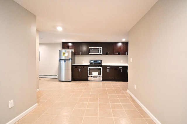86 Lander St, Newburgh, NY 12550 - kitchen with stainless steel appliances, baseboard heating, baseboards, recessed lighting, and dark brown cabinets