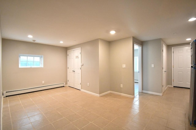 86 Lander St, Newburgh, NY 12550 - empty room featuring a baseboard radiator, recessed lighting, baseboards, light tile patterned floors, and baseboard heating