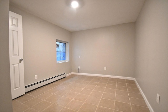 86 Lander St, Newburgh, NY 12550 - spare room with baseboard heating, light tile patterned flooring, and baseboards