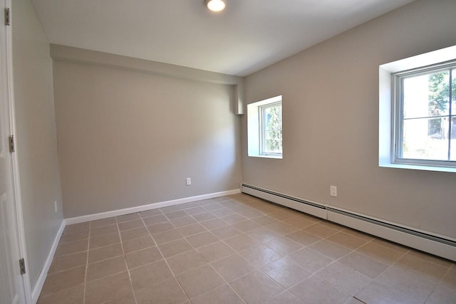 86 Lander St, Newburgh, NY 12550 - empty room with baseboard heating, tile patterned flooring, and baseboards