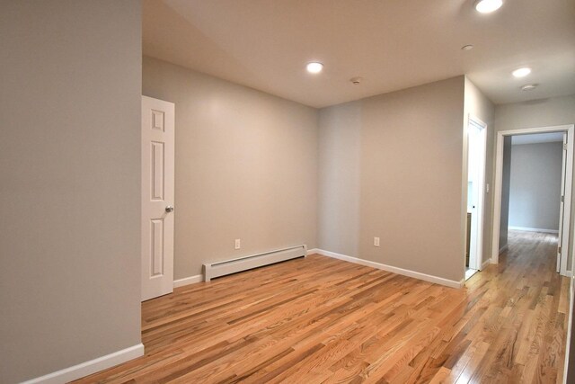 86 Lander St, Newburgh, NY 12550 - spare room with a baseboard radiator, light wood finished floors, baseboards, and recessed lighting