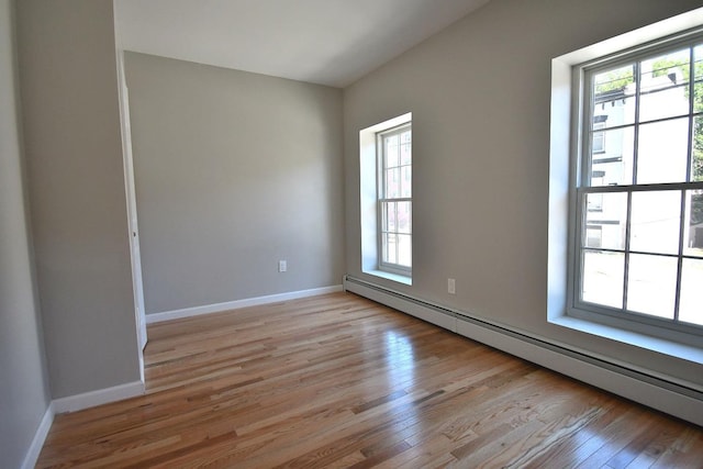 86 Lander St, Newburgh, NY 12550 - unfurnished room featuring baseboard heating, light wood-style floors, and baseboards