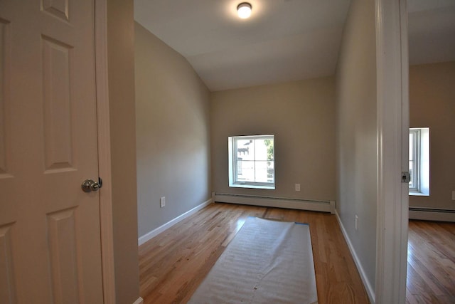 86 Lander St, Newburgh, NY 12550 - spare room with a baseboard radiator, wood finished floors, baseboards, and lofted ceiling