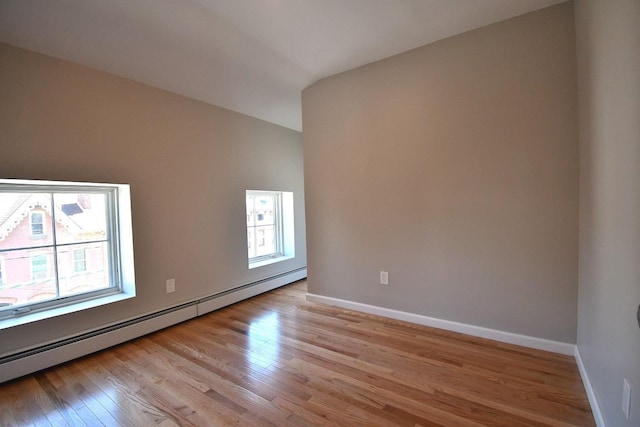 86 Lander St, Newburgh, NY 12550 - unfurnished room featuring plenty of natural light, a baseboard heating unit, and light wood-style floors