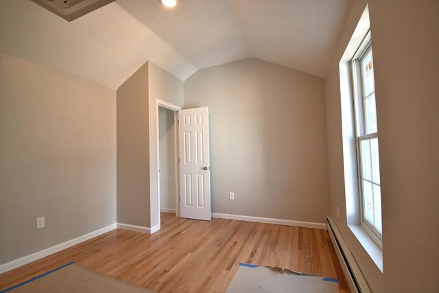 86 Lander St, Newburgh, NY 12550 - bonus room featuring a baseboard radiator, light wood-type flooring, vaulted ceiling, and baseboards
