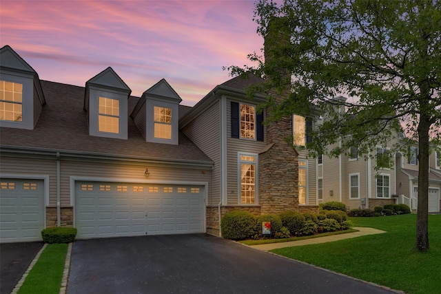 30 Toni Ct Unit 30, Center Moriches, NY 11934 - view of front of property with stone siding, driveway, a yard, and roof with shingles