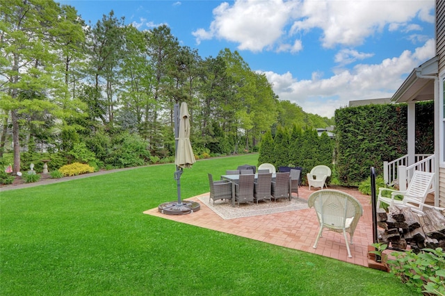 30 Toni Ct Unit 30, Center Moriches, NY 11934 - view of green lawn with a patio area, outdoor dining space, and view of scattered trees