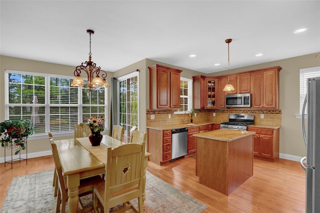 30 Toni Ct Unit 30, Center Moriches, NY 11934 - kitchen featuring appliances with stainless steel finishes, decorative backsplash, light wood-style floors, and recessed lighting