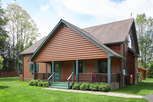 2 Marquette Dr, Rhinebeck, NY 12572 - view of front facade with covered porch, faux log siding, a shingled roof, and central AC unit
